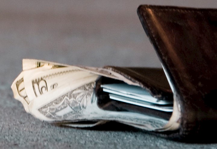 Image of a wallet laying on the floor as if it was dropped