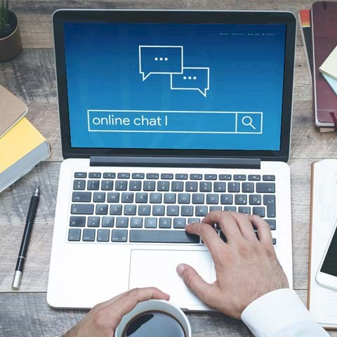 image of computer with online chat screen